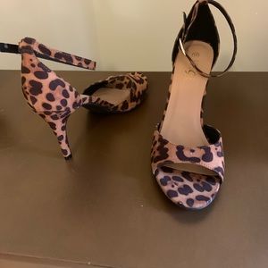 Leopard print open toe heels.